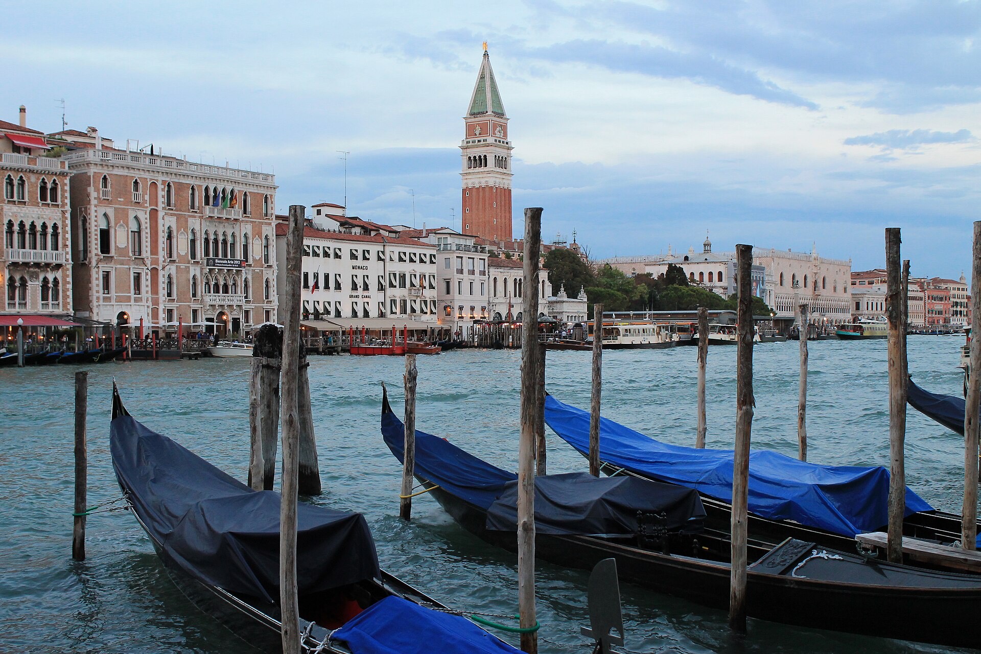 Gondolas moored with St Mark's Campanile in the distance